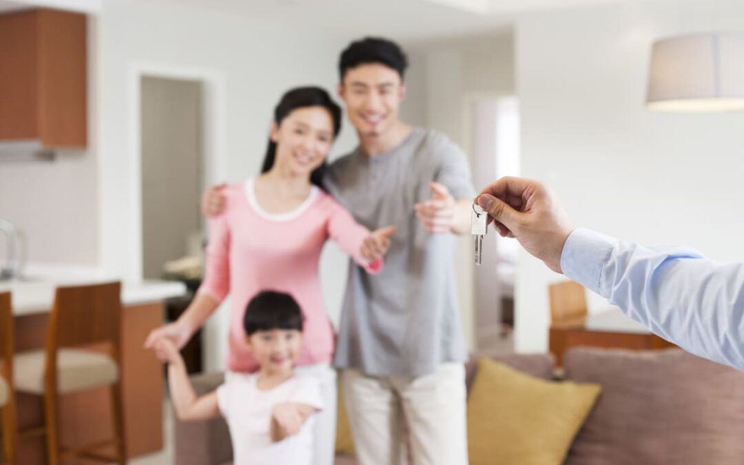 family holding keys