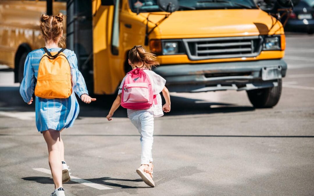kids walking to school bus